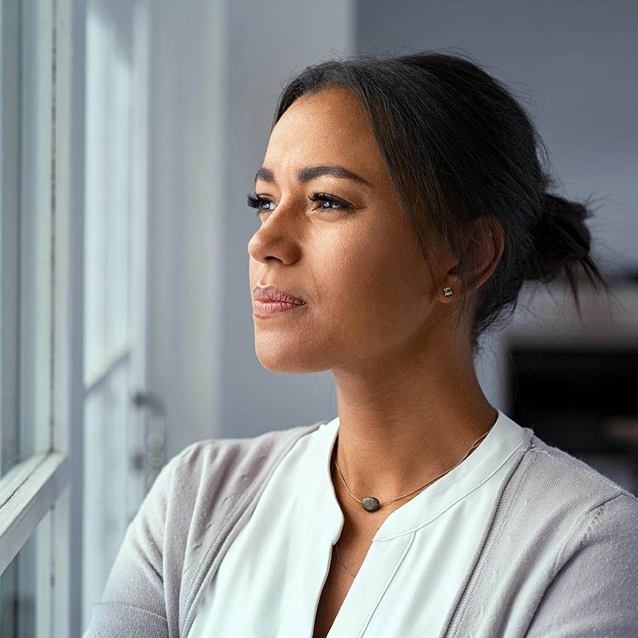 Diana Sharp Psycotherapist - Adult woman looking out of window